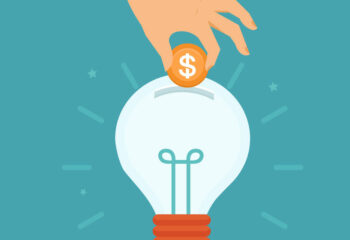 Vector idea attracting money concept in flat style - man's hand putting golden coin inside the light bulb - investment and innovation